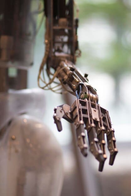A detailed shot of a robotic arm performing a welding task in a US automotive factory, highlighting precision and automated processes.