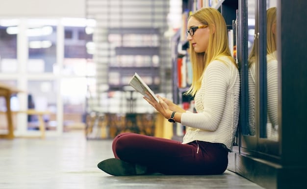 A close-up shot of a library patron using a computer in a modern US library. The focus is on the screen displaying a library database and the patron's hands on the keyboard, highlighting digital access and literacy.