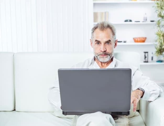 A doctor having a telehealth session with a patient on a laptop. The setting is a modern clinic, and the focus is on the doctor's attentive expression as they listen to the patient.