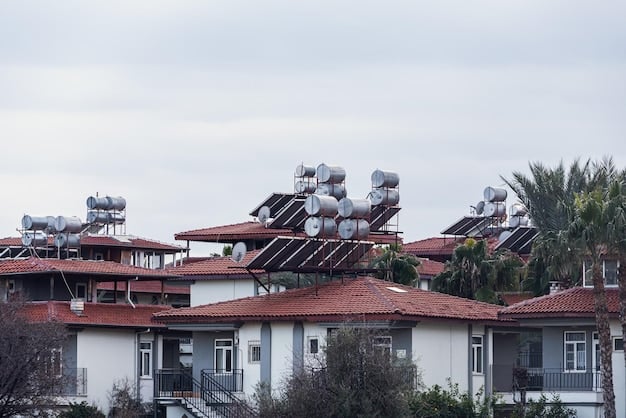 A solar panel installation on the rooftop of a low-income housing complex, symbolizing clean energy access and environmental justice. The image shows the panels with a blue sky in the background.