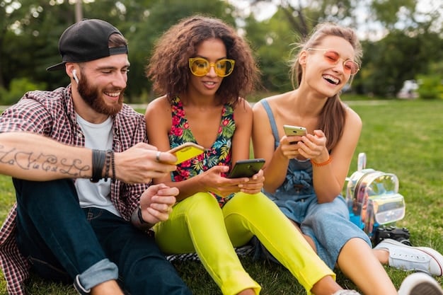 A group of friends laughing and talking together in a park, enjoying each other's company without any digital devices visible. Warm, sunny day.