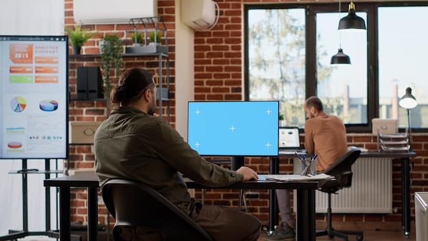An office setting with a person sitting at a desk, reviewing dashboards on dual monitors filled with charts, graphs, and business analytics data. The setting is well-lit and modern, and the focus is on the individual's attentiveness to detail and strategic data evaluation.