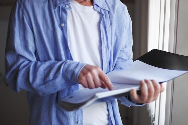 A close-up shot of a person carefully reviewing a grant application document. The image emphasizes attention to detail, accuracy, and thoroughness. The background is blurred to keep the focus on the document and the person's hands.