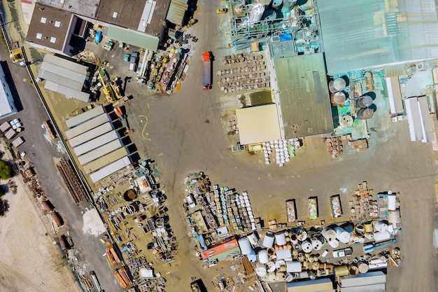 An aerial view of a modern recycling plant, where various materials are being sorted and processed efficiently, highlighting the circular economy in action.