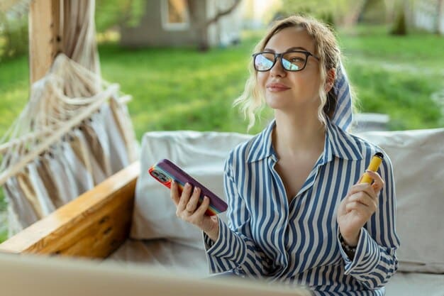 A shopper using an AR app on a smartphone to virtually try on different eyeglasses in their living room. The app accurately displays the eyeglasses on their face, demonstrating fit and style.