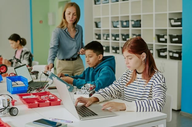 Students in a classroom setting learning about robotics and automation. The students are working on robots and using computers to program them. The environment is collaborative and hands-on, showcasing modern training methods.